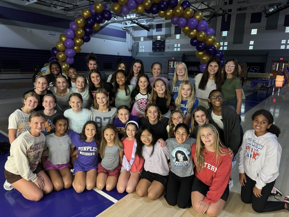 Students taking a photo after the fall 2024 school dance at the BGJHS gymnasium.