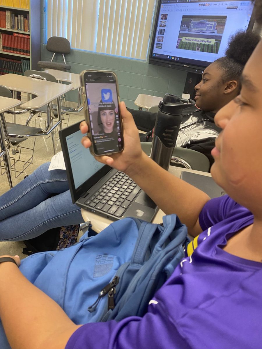 7th grader named Alex Wilson who is on their phone watching TikTok.