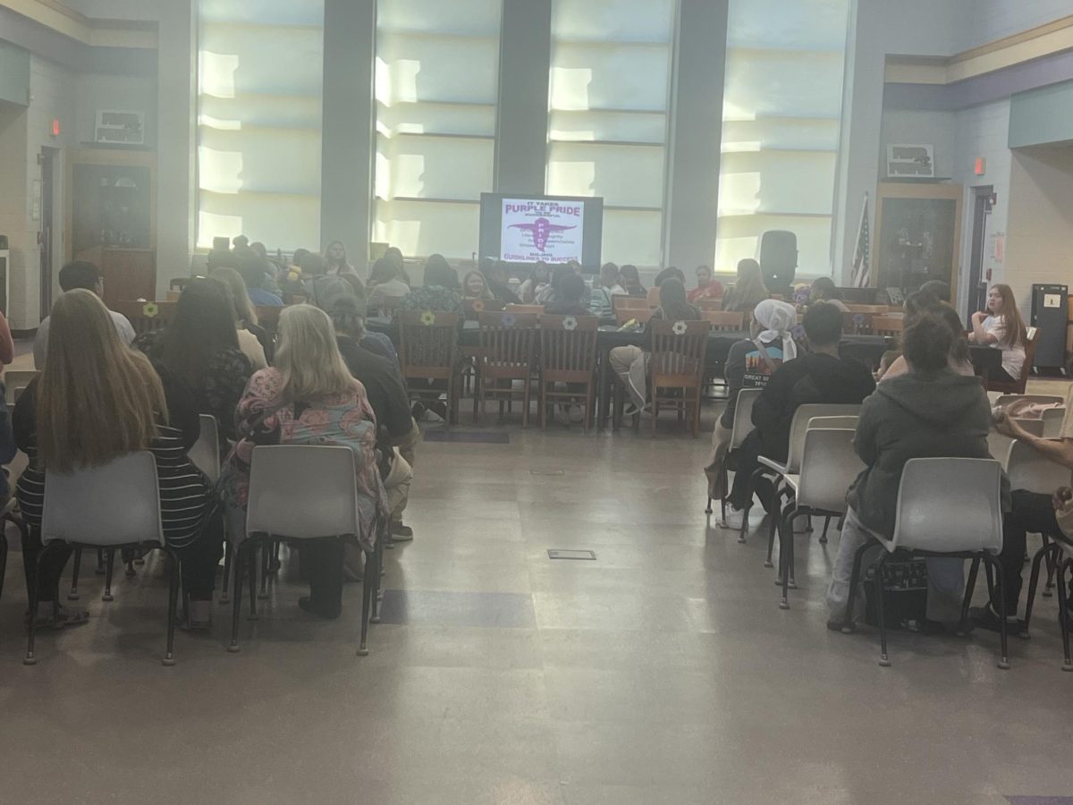 Parents attending the first leadership luncheon in the library.