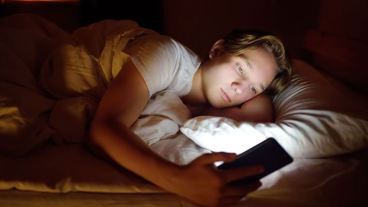 Teenage boy stays up all night on his phone