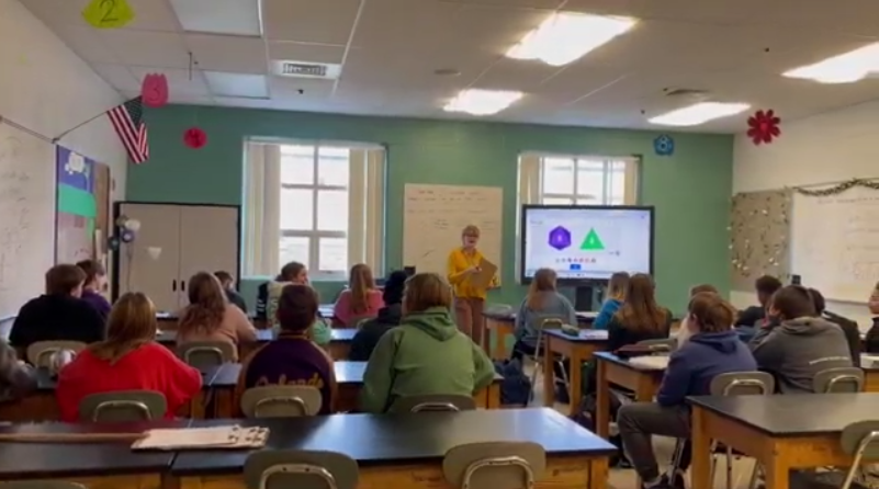 Mrs. Hartlage teaches her 8th grade science class about genetics and preparing for their end of the semester final.