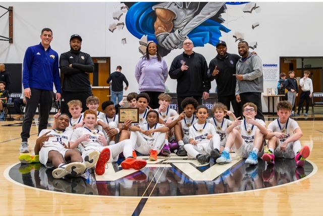 The 7th grade boys basketball team won the district title 