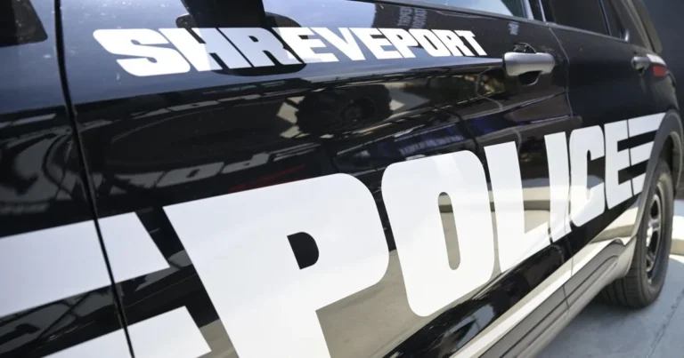 Shreveport police vehicle parked outside the department during a homicide investigation