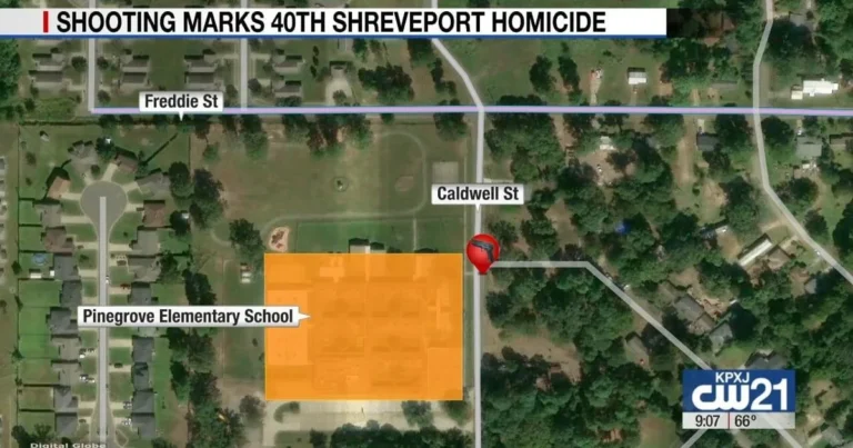 Police investigate a fatal shooting scene on a Shreveport street near a home