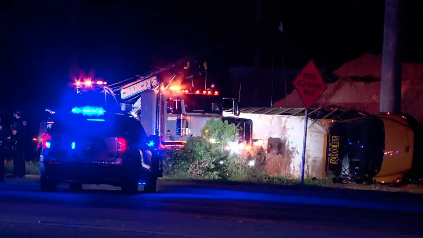 A school bus after a crash with emergency responders nearby