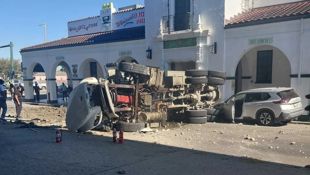 Dump truck crashed off an Interstate 10 bridge in New Orleans with debris on the street below