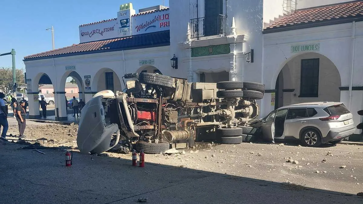 Dump truck crashed off an Interstate 10 bridge in New Orleans with debris on the street below
