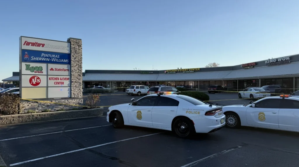 Police investigate a fatal shooting near a northwest Indianapolis strip mall parking lot