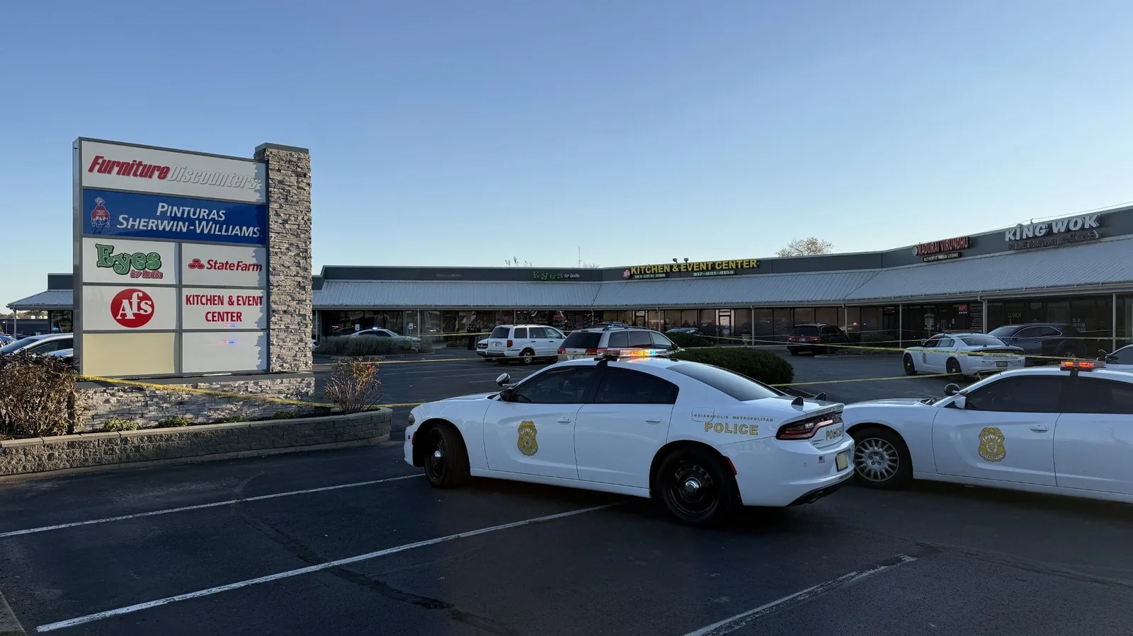 Police investigate a fatal shooting near a northwest Indianapolis strip mall parking lot