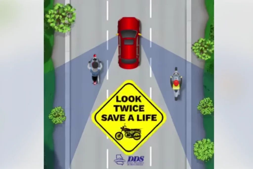 Motorcyclist riding on a Georgia roadway as safety officials urge drivers to look twice