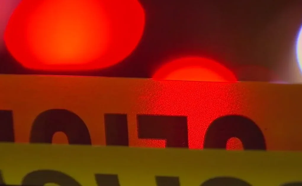 Police investigate an overturned pickup truck at a Marietta intersection after a fatal crash