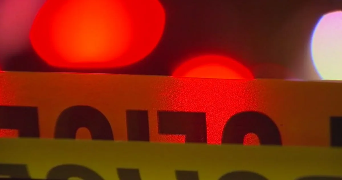 Police investigate an overturned pickup truck at a Marietta intersection after a fatal crash