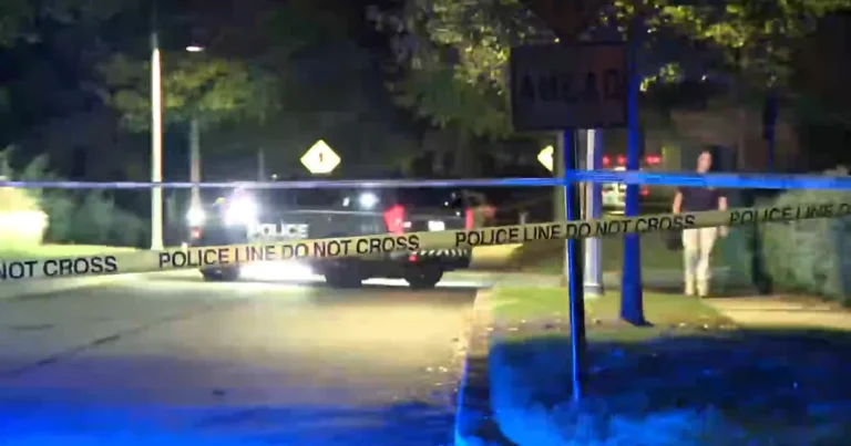 Police tape and emergency vehicles near a shooting scene in Woodstock, Georgia